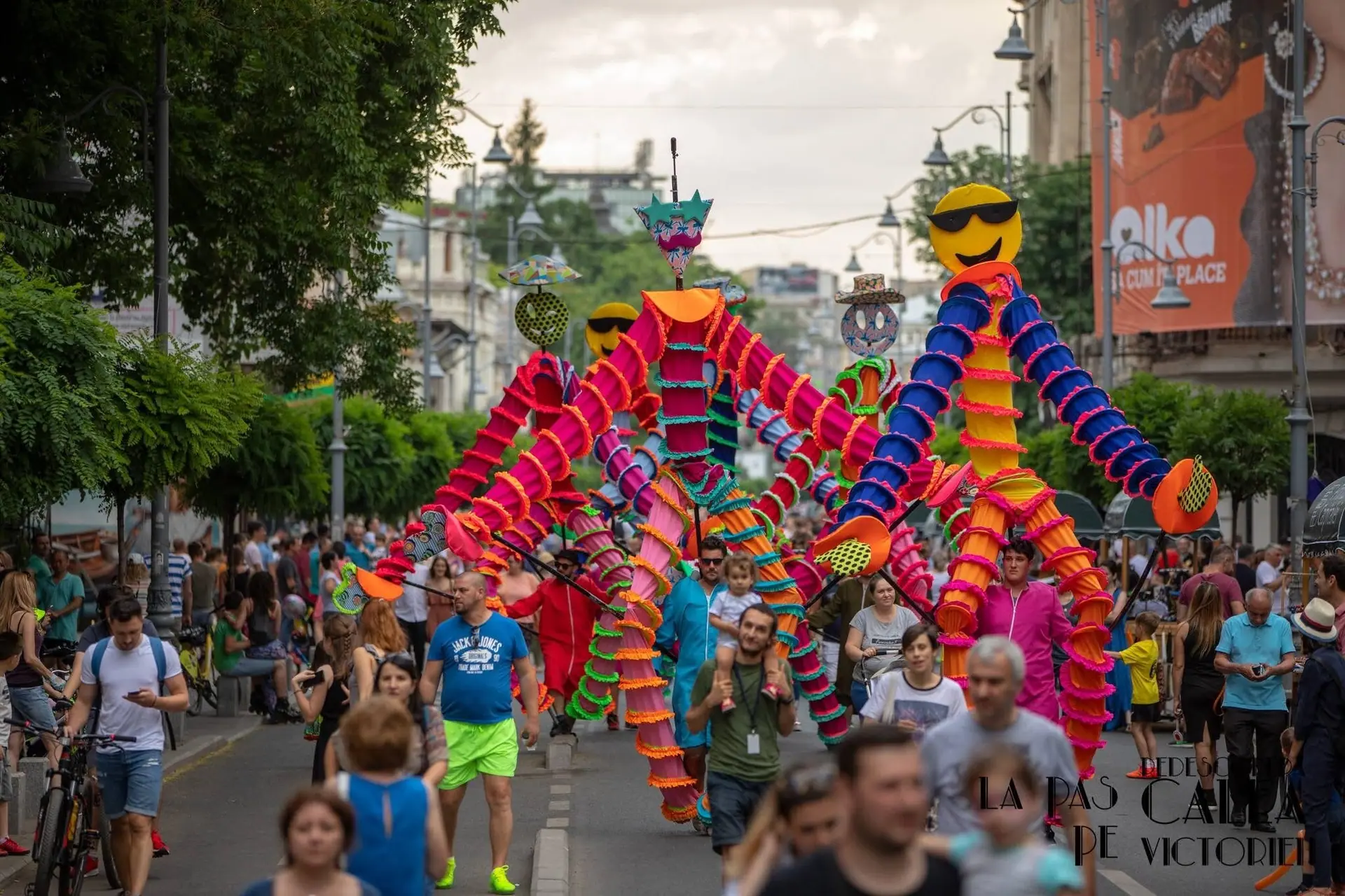 Over 80 Elevarts performers at once on a pedestrianised Calea Victoriei — living statues, period characters, giant puppets and mimes, on every corner.