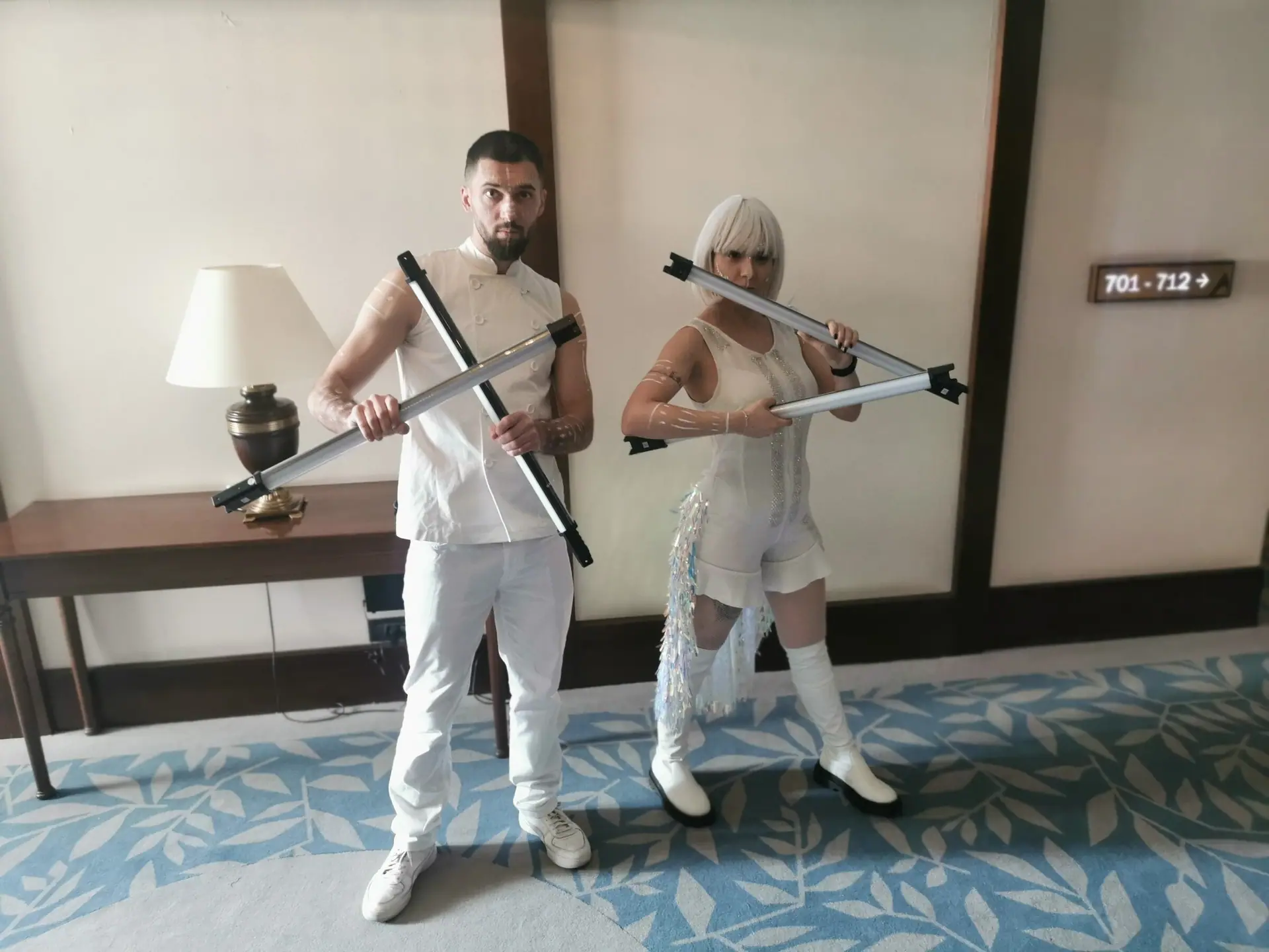 Two performers in white, LED sticks in sync, a few minutes on the Oriflame stage at Hotel International in Sinaia.