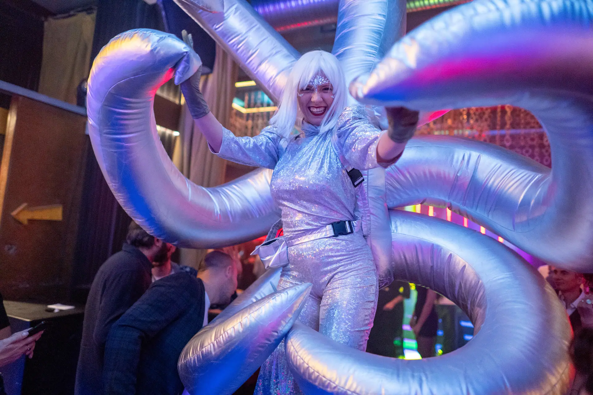 LED Robots, Mirror Men, a silver Octopus with inflatable tentacles and LED dancers, rotated from one edition to the next since 2021.